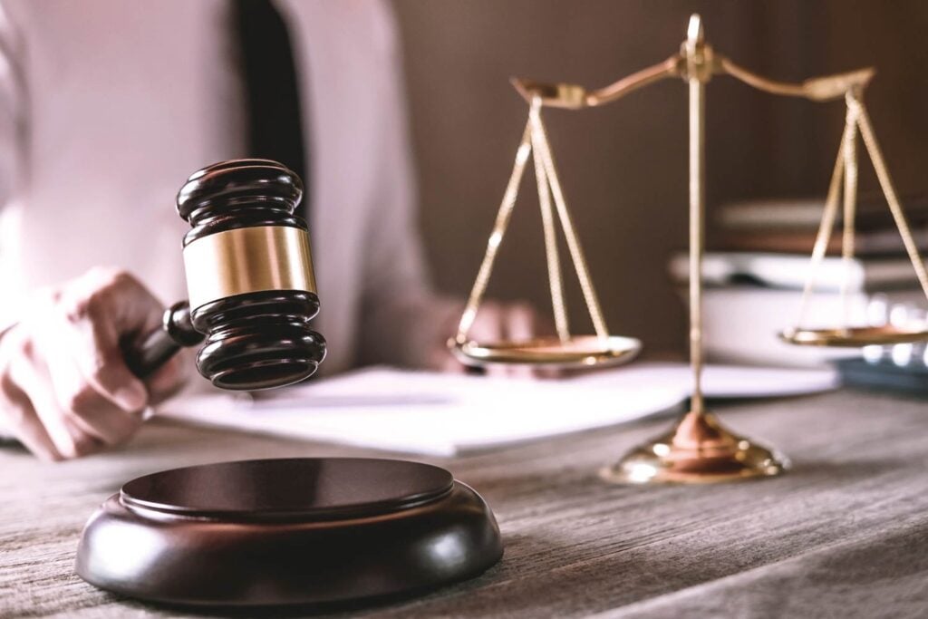 Gavel On Wooden Table And Lawyer Or Judge Working 259