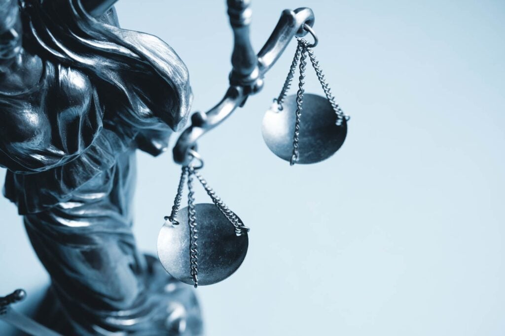 Greyscale Cropped View Of The Scales Of Justice